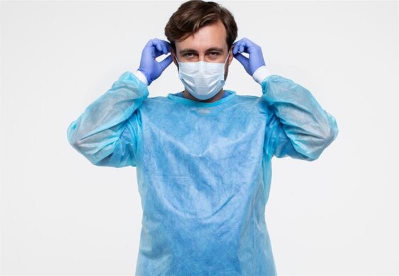 Doctor in isolation gown